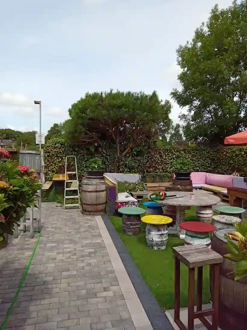 A landscaped patio and seating area by M.R. Garden Services